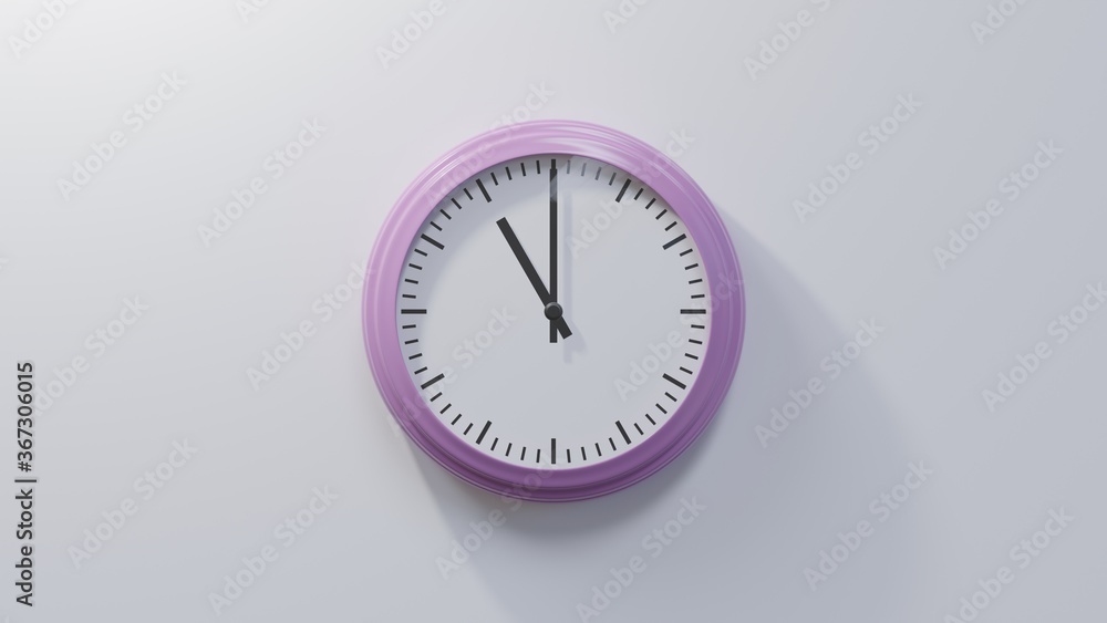 Glossy pink clock on a white wall at eleven o'clock. Time is 11:00 or 23:00 Glossy pink clock on a white wall at eleven o'clock. Time is 11:00 or 23:00