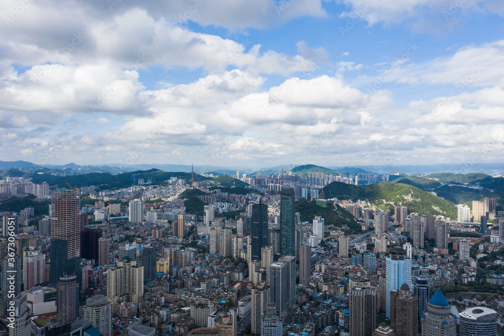 Aerial view of modern city and mountains