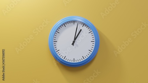 Glossy blue clock on a orange wall at two past one. Time is 01:02 or 13:02