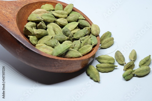 Green Dried cardamom seeds isolated on white background