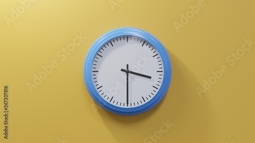 Glossy blue clock on a orange wall at half past three. Time is 03:30 or 15:30