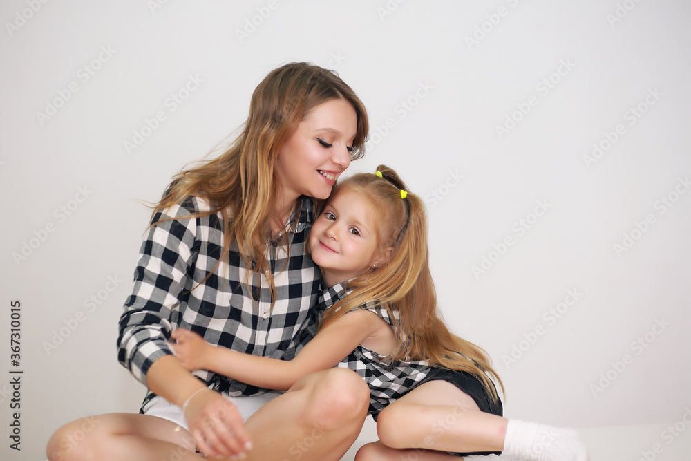 Happy loving family. Mother and her girl play, kiss and hug. Happy loving family. Mother and her girl play, kiss and hug.