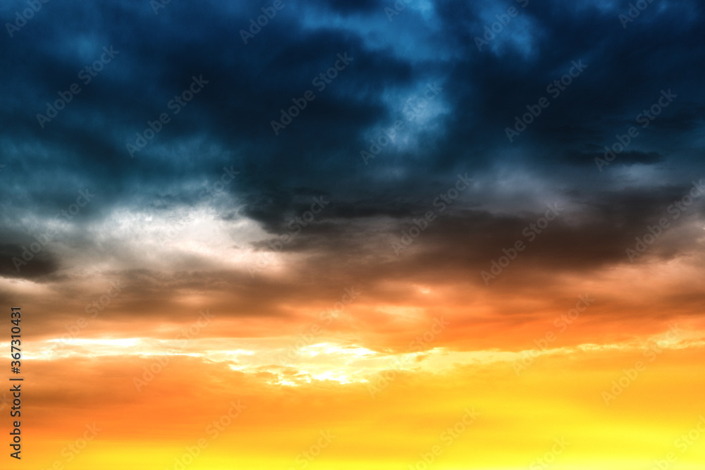 Colorful and peaceful sunset with red-tinted clouds. Sky Background or texture