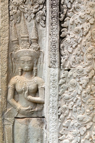 Beautiful bas-relief in Angkor wat temple in Cambodia, representing dancing apsara - female spirit popular in 12th century Cambodia.