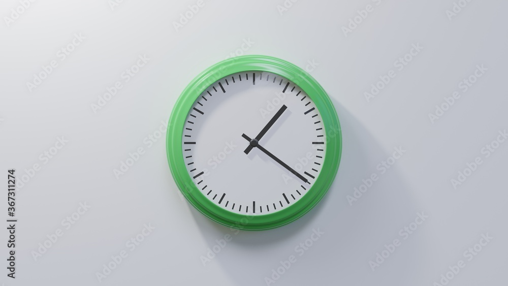 Glossy green clock on a white wall at twenty-one past one. Time is 01:21 or 13:21 Glossy green clock on a white wall at twenty-one past one. Time is 01:21 or 13:21