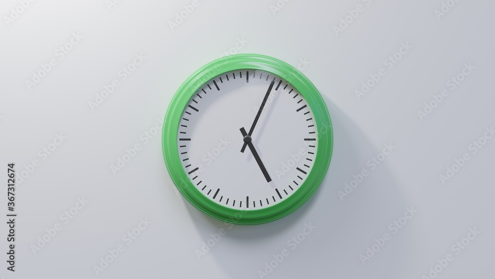 Glossy green clock on a white wall at four past five. Time is 05:04 or 17:04 Glossy green clock on a white wall at four past five. Time is 05:04 or 17:04