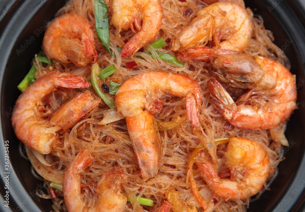 Close up of  typical Chinese Sichuan province style Cuisine XO sauce Fried shrimps and vermicelli in clay pot