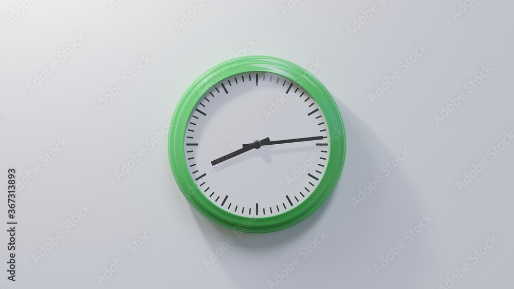 Glossy green clock on a white wall at fourteen past eight. Time is 08:14 or 20:14 Glossy green clock on a white wall at fourteen past eight. Time is 08:14 or 20:14