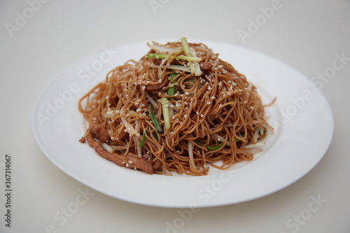 Close up of  Chinese Hong Kong and Cantonese style cuisine Soy sauce fried noodle with bean sprouts and shredded pork