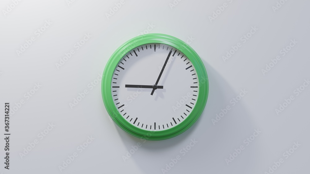 Glossy green clock on a white wall at four past nine. Time is 09:04 or 21:04 Glossy green clock on a white wall at four past nine. Time is 09:04 or 21:04