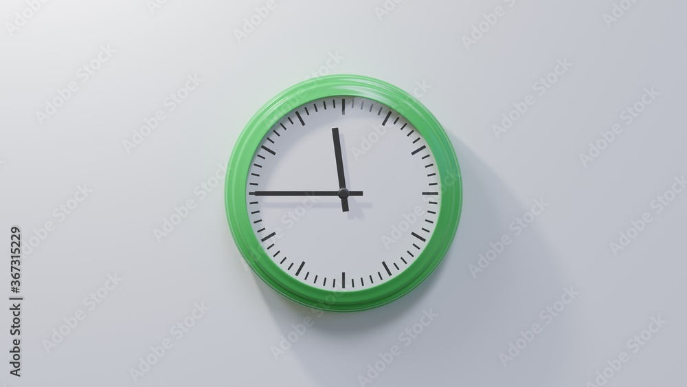 Glossy green clock on a white wall at quarter to zero. Time is 11:45 or 23:45 Glossy green clock on a white wall at quarter to zero. Time is 11:45 or 23:45