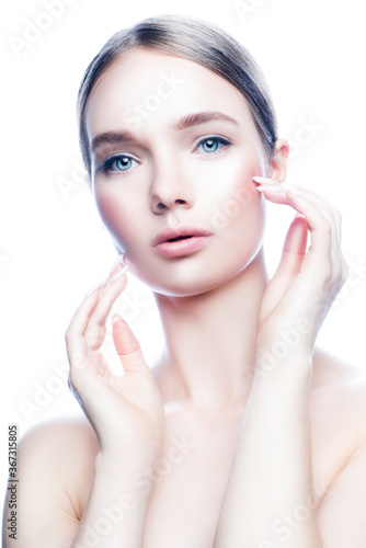 Close-up beauty face of girl with healthy skin  natural make-up. Young model woman with hands near face. Isolated over white background
