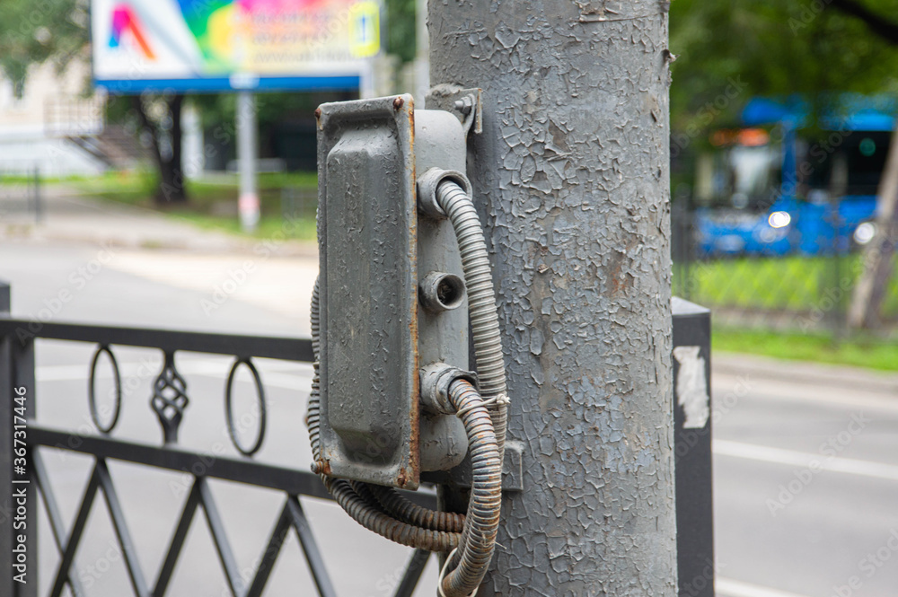 Street switching electric box on an iron pole
