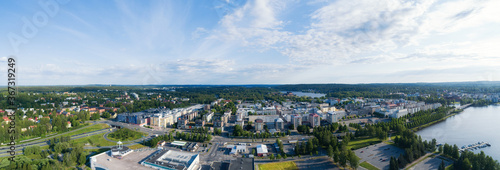 Aerial panoramic cityscape view of a beautiful city Hameenlinna in Finland. Dramatic morning sky with clouds. Summer season. 
