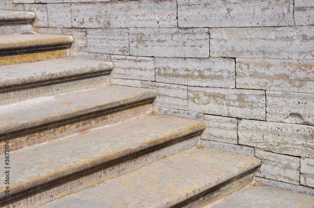 Concrete stairs leading up with concrete wall out of building Concrete stairs leading up with concrete wall out of building