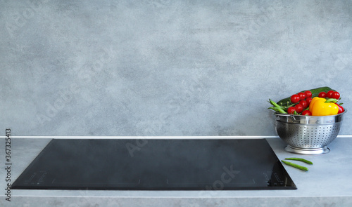 Photos Induction cooker in modern kitchen.