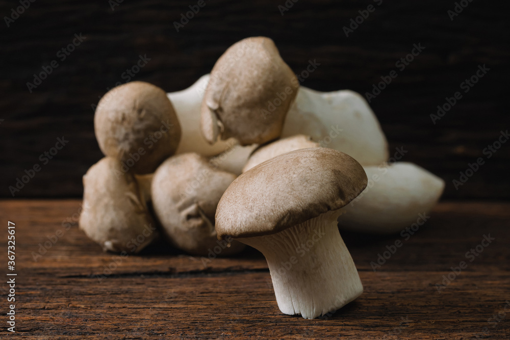 Mushroom on an old wooden table Mushroom on an old wooden table