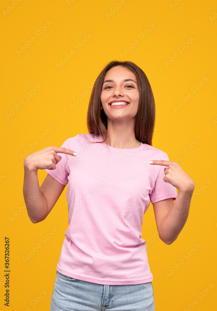 Cheerful young woman in pink shirt and jeans Cheerful young woman in pink shirt and jeans