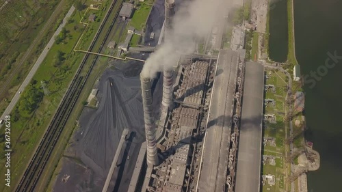 Chimneys of a thermal power plant. Shooting from the height of an energy object running on fossil fuels. Burshtyn Ukraine. photo