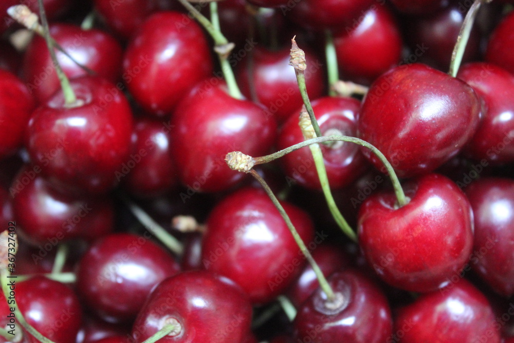 red cherries on fruit background red cherries on fruit background