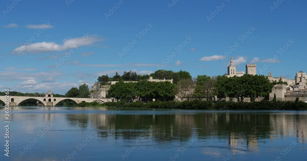 The Saint Benezet bridge, the old city, Avignon, Vaucluse department, France. In the foreground is the river Rhone. The Saint Benezet bridge, the old city, Avignon, Vaucluse department, France. In the foreground is the river Rhone.