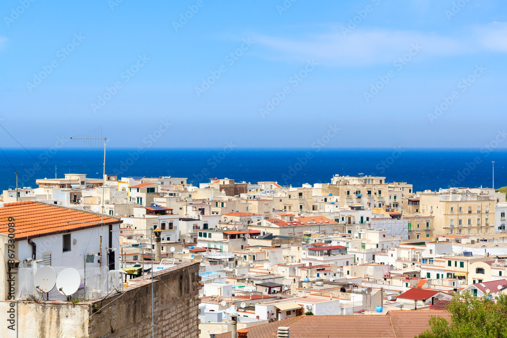 Panorama of Vieste town in Gargano, Puglia, South-East Italy. Sea is visible on the horizon. 