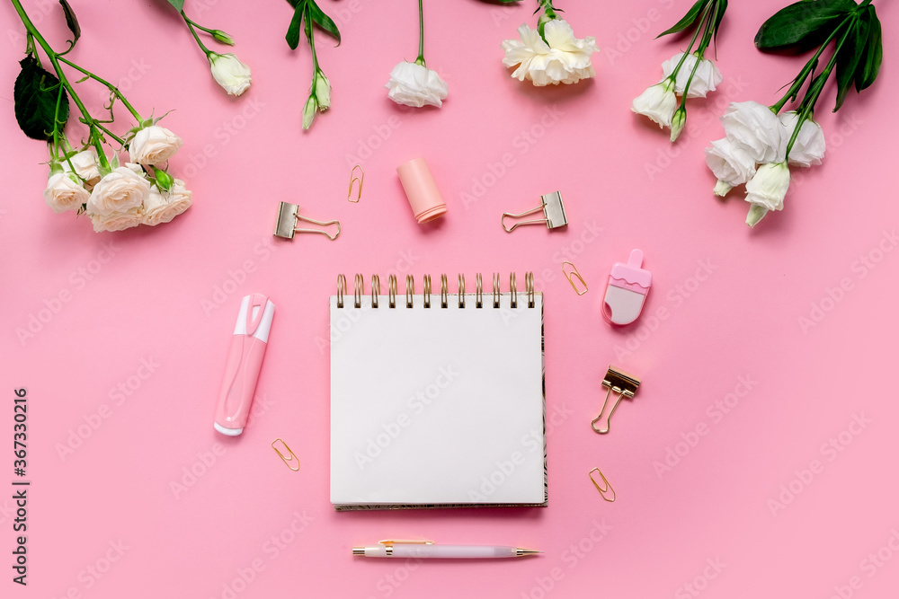 Female hands writing wish list top horizontal view copyspace. To do list flowers and stationery. Top horizontal view Female hands writing wish list top horizontal view copyspace. To do list flowers and stationery. Top horizontal view