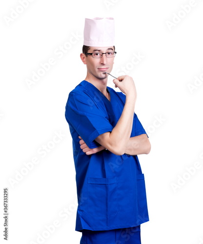 A man in a blue doctor suit and cap on a white background  isolated
