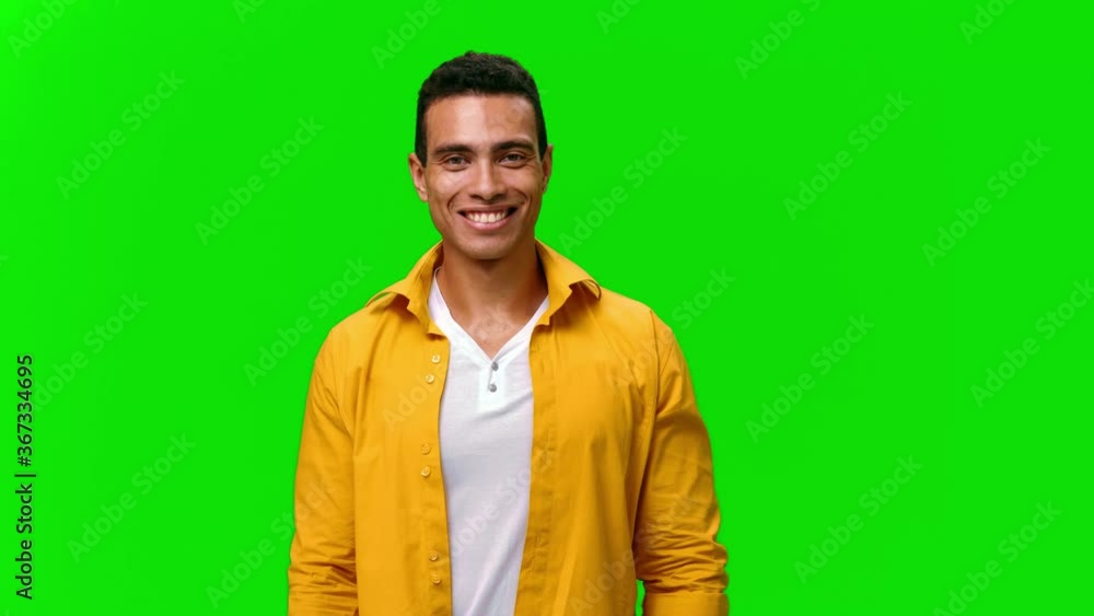 Laughing man welcoming, waving hand and saying Laughing man welcoming, waving hand and saying