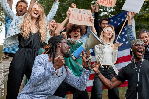 young people draw attention to the problem of marijuana protests, it is a global movement manifesto fighting for a rational approach towards hemp plant © Roman