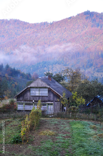 Spring landscape view in the mountains village. Sunset colors. Carpathian mountains, Ukraine.