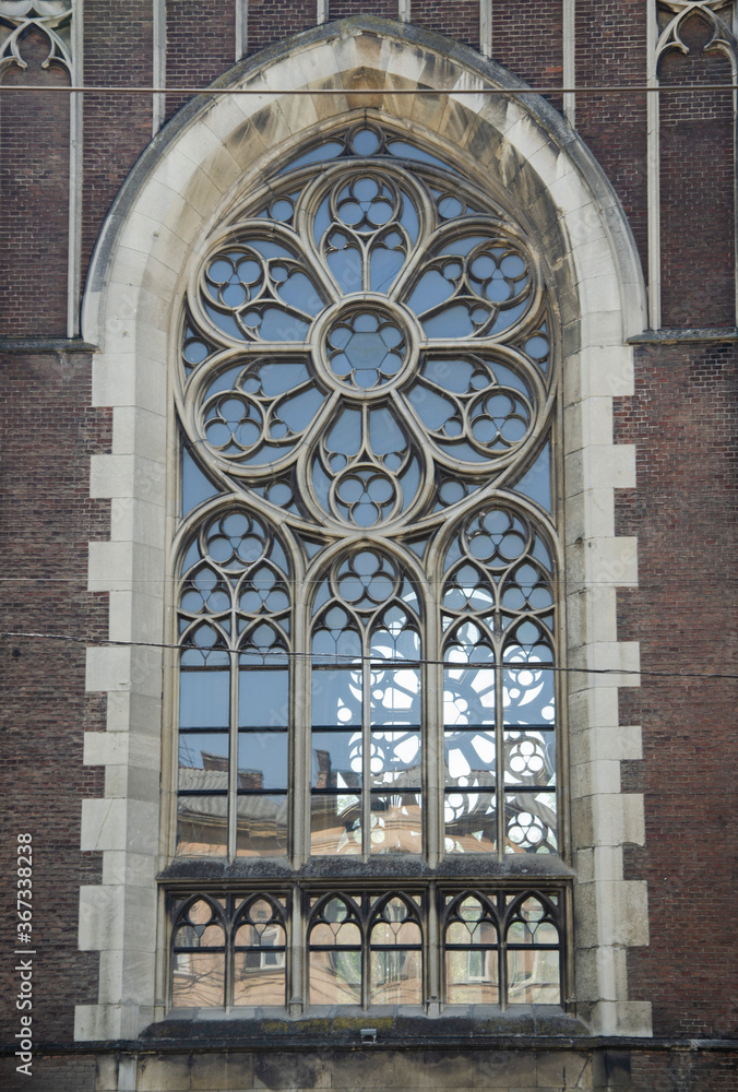 Beautiful architecture detail. Gothic style window. Ornamented rose window of a cathedral in gothic style. Lviv, Ukraine