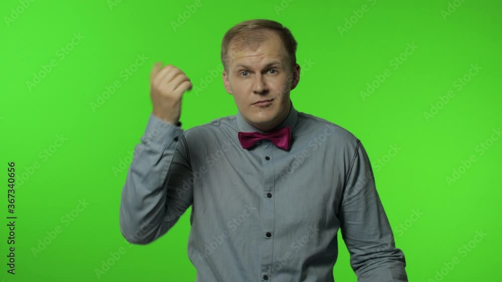 You are crazy, out of mind. Annoyed man pointing at camera and showing stupid gesture, blaming idiot You are crazy, out of mind. Annoyed man pointing at camera and showing stupid gesture, blaming idiot