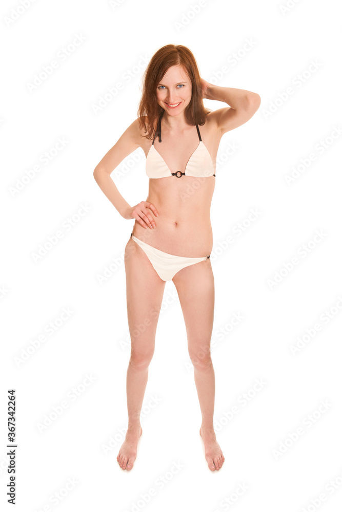 Full length portrait of a beautiful smiling woman wearing a white bikini, isolated on white studio background Full length portrait of a beautiful smiling woman wearing a white bikini, isolated on white studio background