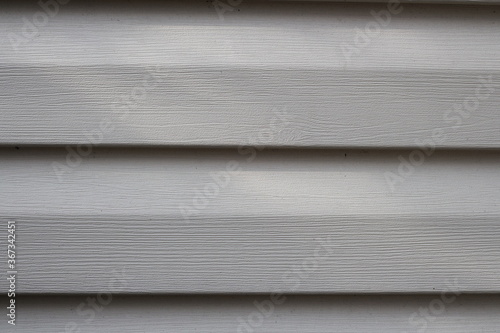 Part of wall from plastic siding close up, background image