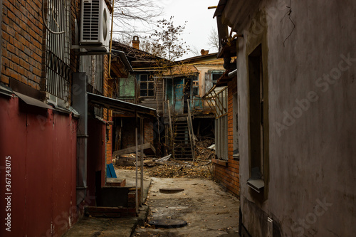 The cluttered old courtyard of an old house built before the revolution in Russia.