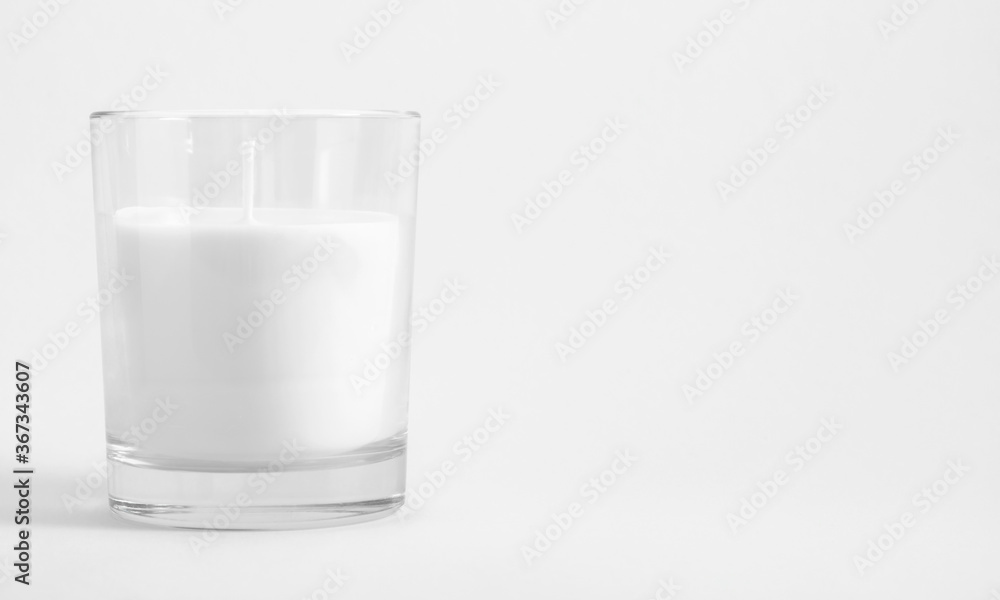 White candle in transparent glass on white background, mock up White candle in transparent glass on white background, mock up