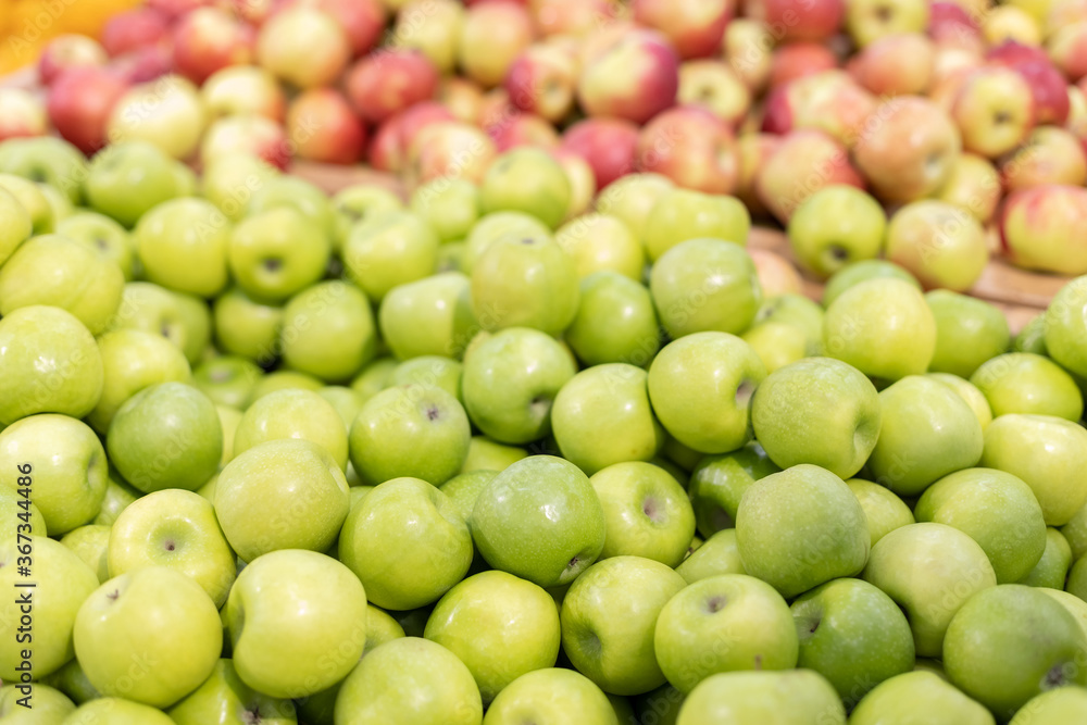 background of green apples on sale at the local market background of green apples on sale at the local market