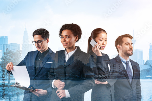 Group of four business colleagues in suits working on project together to gain new career opportunities. Concept of multinational corporate team. Kuala Lumpur. Double exposure. photo