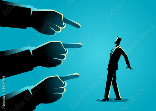 Businessman being pointed by giant fingers