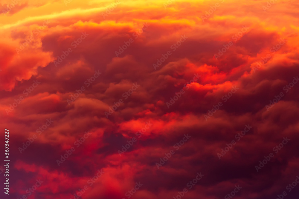 Red-yellow сumulus clouds on sunset