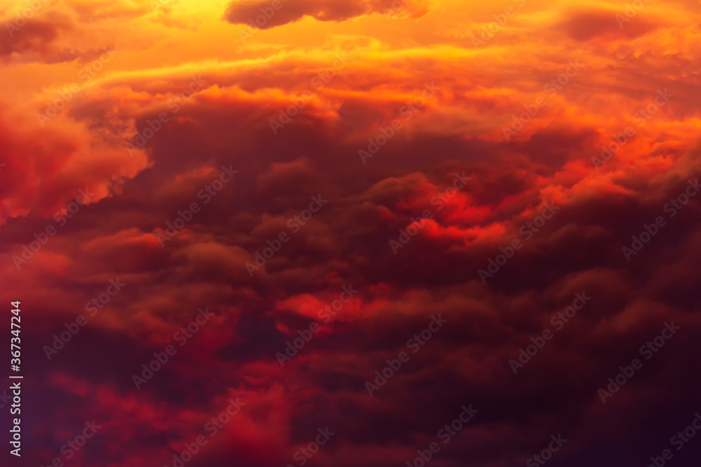 Volume red-yellow сumulus clouds on sunset