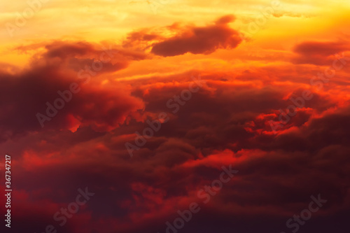 Volume сumulus clouds on sunset © IuriiA