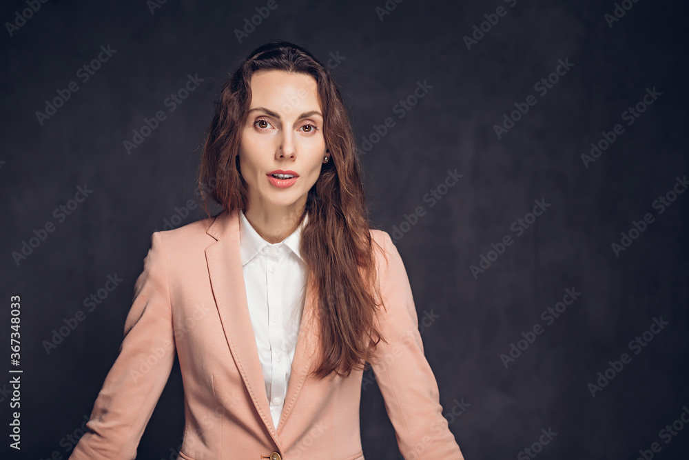 Worried adult caucasian woman on dark background Worried adult caucasian woman on dark background