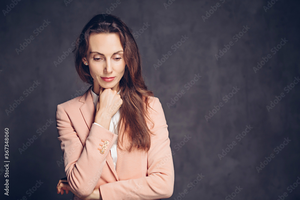 Depressed adult caucasian woman on dark background Depressed adult caucasian woman on dark background
