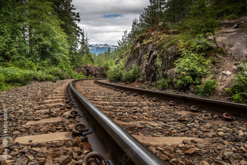 Traintracks leading up to a mountain near Blue River, British Columbia