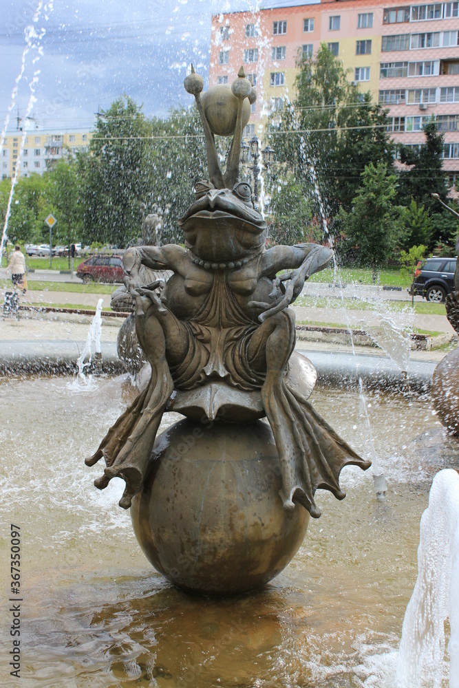 A small fountain with a fairy-tale frog princess. Russia.