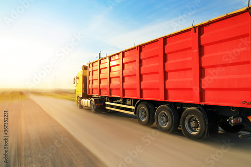 Logistics concept. Truck on country road, motion blur effect