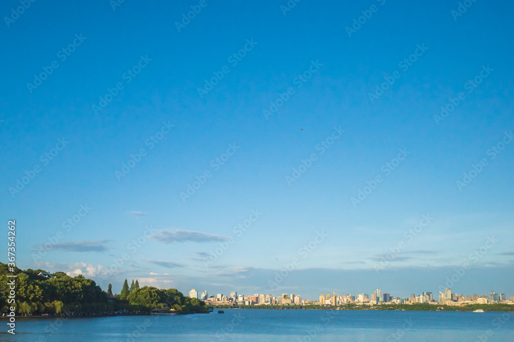 West Lake and skyline of city centre of Hangzhou, China