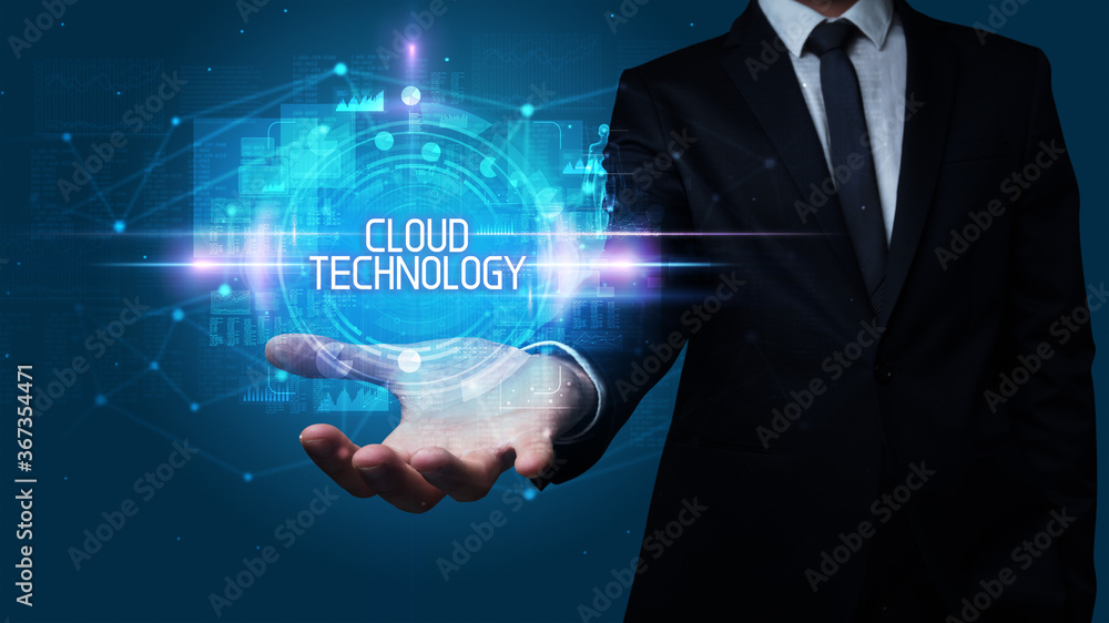 Man hand holding CLOUD TECHNOLOGY inscription, technology concept Man hand holding CLOUD TECHNOLOGY inscription, technology concept